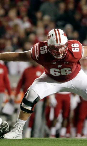Badgers' blockers open holes, then enjoy watching Taylor